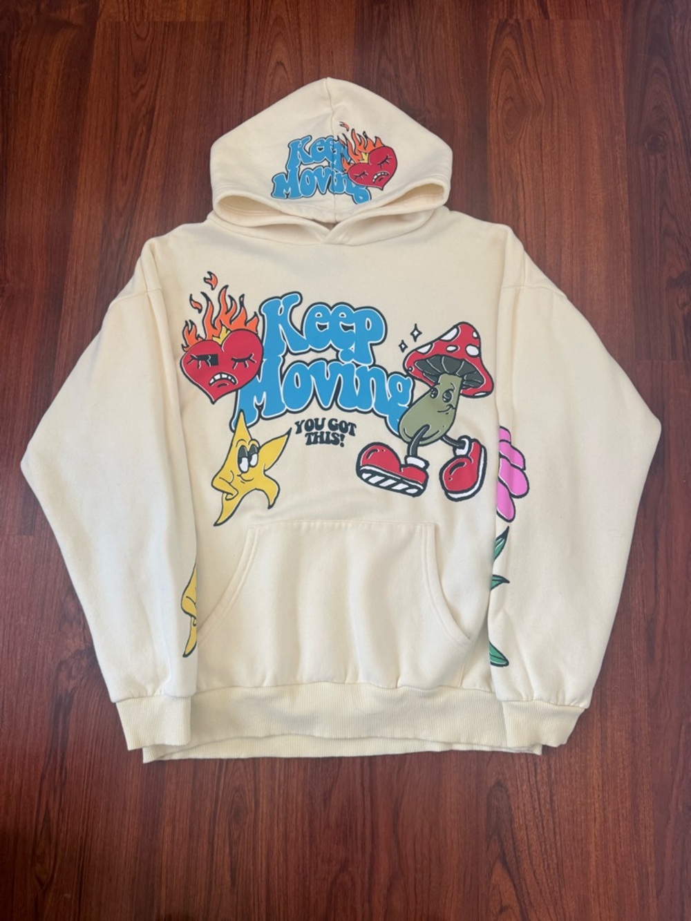Cream "Keep Moving" Graphic Hoodie with Colorful Cartoon Print
